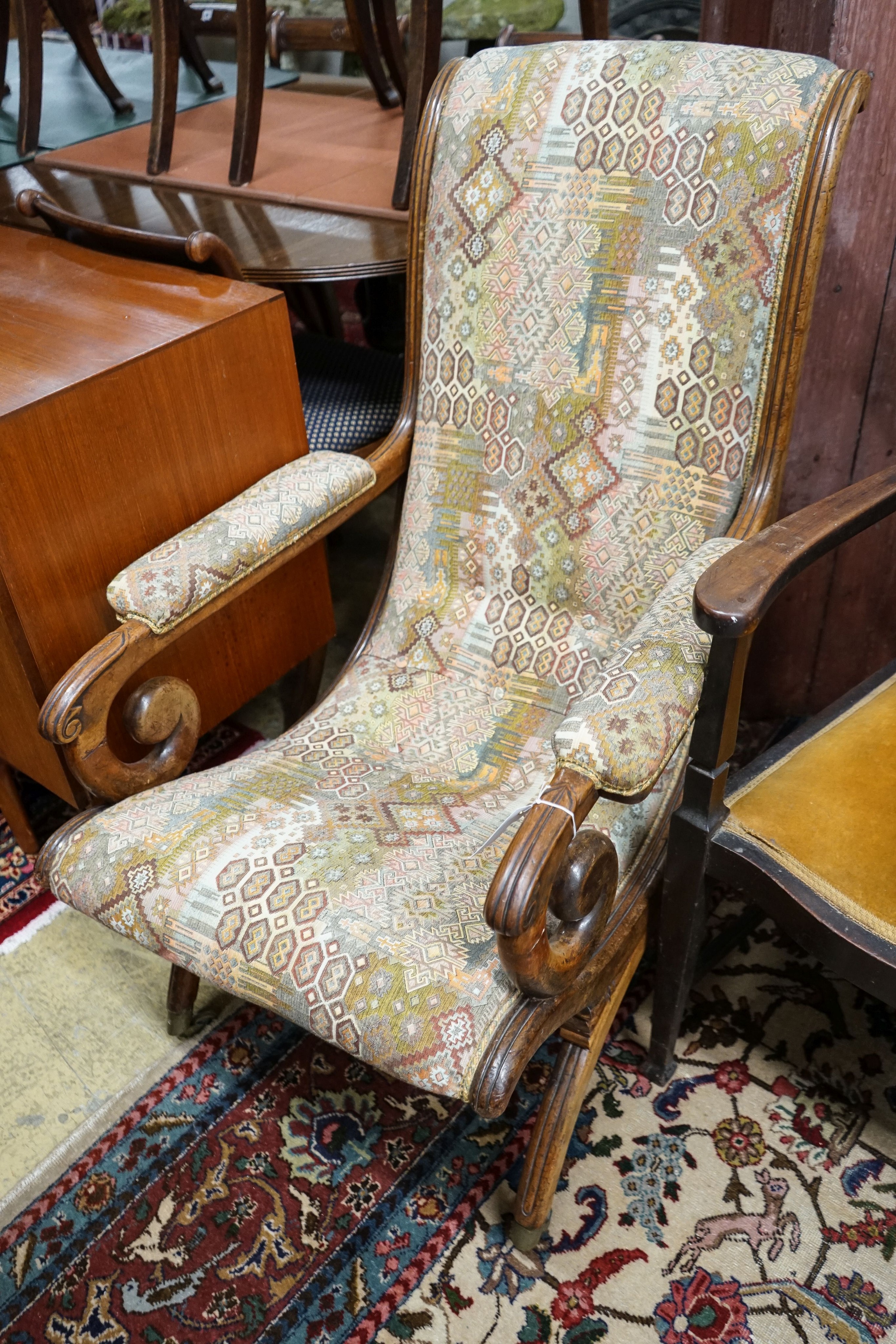 A Regency mahogany scroll armchair